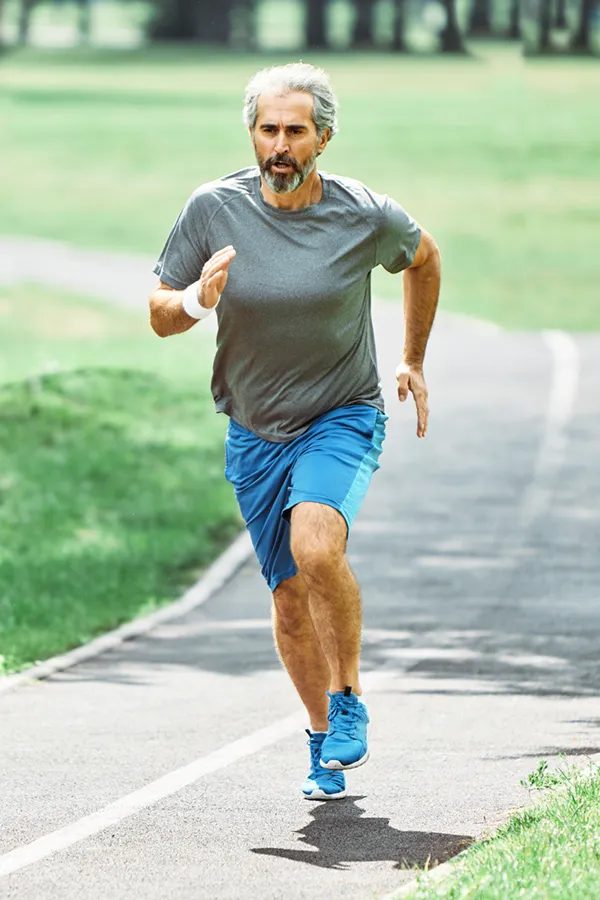 A man running on a track. Get treatment for ACL tears from ProCare Wellness Institute in Virginia Beach.