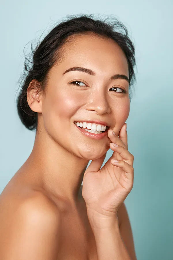 An asian woman with beautiful skin. Get facial treatments from ProCare Wellness Institute in Virginia Beach.