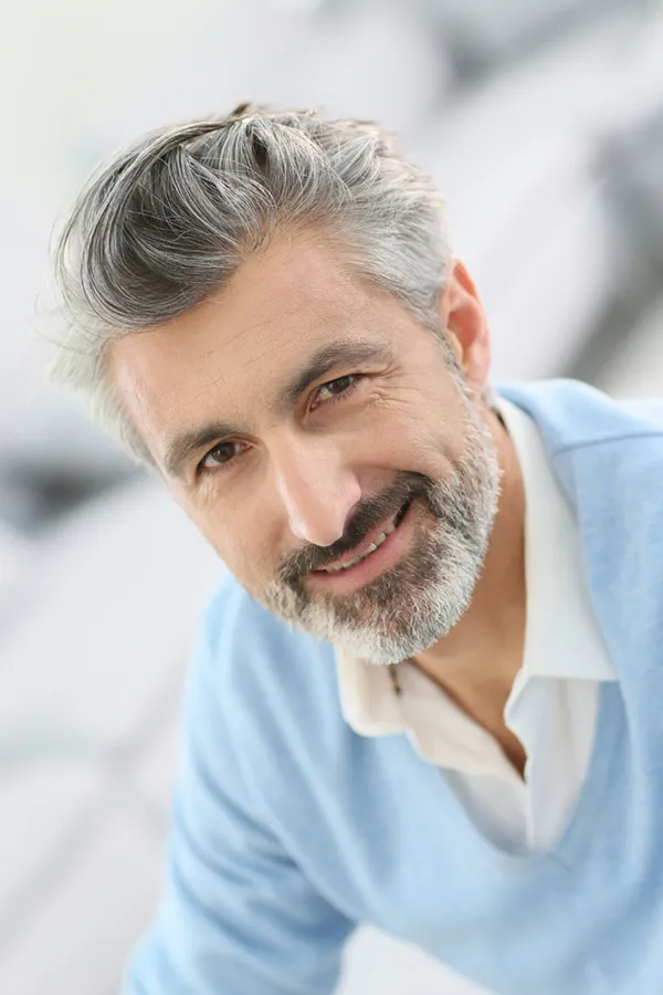 A man with a full head of hair. Get PRP for hair restoration from ProCare Wellness Institute in Virginia Beach.