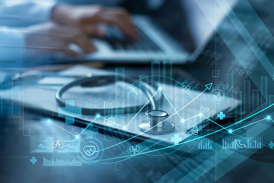 A clinician studies results on a laptop with a sethoscope and clipboard next to him, and an illustrated overlay of medical symbols. Get regenerative medicine treatment from ProCare Wellness Institute in Virginia Beach.